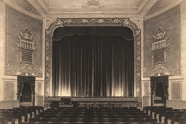 The historic Lee Theater stage and its ornate proscenium, from the photograph displayed in the restaurant.